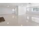 Bright and airy living room featuring tile flooring, clean lines, and a fresh, minimalist design at 16411 Lake Byrd Dr, Tampa, FL 33618