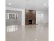 Spacious living room with a striking stone fireplace and tile floors at 16411 Lake Byrd Dr, Tampa, FL 33618