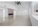 Bright living room boasts fireplace, tile flooring, and ample space at 16411 Lake Byrd Dr, Tampa, FL 33618