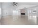 Bright, open-concept living room with a modern fireplace and tile flooring throughout at 16411 Lake Byrd Dr, Tampa, FL 33618