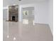 Open-concept living room featuring tile flooring, fireplace and an abundance of natural light at 16411 Lake Byrd Dr, Tampa, FL 33618