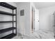 A utility room features modern shelving and access to a shower at 16411 Lake Byrd Dr, Tampa, FL 33618
