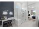 Modern bathroom featuring a glass walk-in shower and a vanity area at 17093 Moonflower Dr, Venice, FL 34293