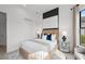 Well-lit bedroom with modern accent wall and neutral decor at 17093 Moonflower Dr, Venice, FL 34293