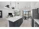 Open concept kitchen with island opens up to the living and dining areas at 17093 Moonflower Dr, Venice, FL 34293