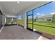 Screened lanai with brick flooring and views of the lush backyard and landscaping at 17093 Moonflower Dr, Venice, FL 34293