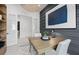 Bright office space with wood floors, modern desk, and gray accent wall at 17093 Moonflower Dr, Venice, FL 34293