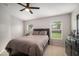 Cozy bedroom featuring comfortable bedding and ample natural light at 17413 Garden Heath Ct, Land O Lakes, FL 34638