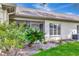 Backyard view shows a patio, beautiful landscaping, and a well-maintained exterior at 18807 Tournament Trl, Tampa, FL 33647