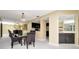 Charming dining room with a wet bar, creating an ideal space for dining and entertaining guests at 18807 Tournament Trl, Tampa, FL 33647