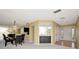 Open-concept dining area with a bar and natural light, perfect for hosting intimate gatherings at 18807 Tournament Trl, Tampa, FL 33647