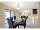 Bright dining room features sliding glass doors, creating a seamless transition to the outdoor living space at 18807 Tournament Trl, Tampa, FL 33647