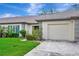Attractive single Gathering home with neat landscaping, two-car garage, and a well kept lawn at 18807 Tournament Trl, Tampa, FL 33647
