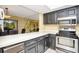 The kitchen features dark cabinets and white counters, adjacent to the dining area for easy serving at 18807 Tournament Trl, Tampa, FL 33647