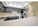 Modern kitchen boasts stainless steel appliances and ample counter space, making it a chef's delight at 18807 Tournament Trl, Tampa, FL 33647
