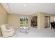 Bright living space featuring sliding glass doors that offer natural light and access to the outside at 18807 Tournament Trl, Tampa, FL 33647