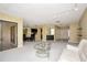 Inviting living room showcases a wet bar, opening up to the dining area, creating an ideal space for gatherings at 18807 Tournament Trl, Tampa, FL 33647