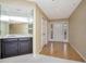 Open-concept living area with a bar, neutral color scheme, and access to outdoor spaces at 18807 Tournament Trl, Tampa, FL 33647
