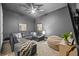 Cozy bonus room features a comfortable sectional sofa, beanbag chair, and entertainment center at 1915 Floresta View Dr, Tampa, FL 33618