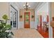 Inviting foyer with tiled floors, decorative moldings, and a view of the dining room at 1915 Floresta View Dr, Tampa, FL 33618