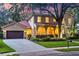 Beautiful two-story home with a red tile roof, and a front yard at 1915 Floresta View Dr, Tampa, FL 33618