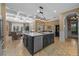 Spacious kitchen island with seating and stone counters, open to dining and living areas for easy entertaining at 1915 Floresta View Dr, Tampa, FL 33618