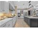 Beautiful kitchen with stainless appliances, modern countertops, and a central island for prep and dining at 1915 Floresta View Dr, Tampa, FL 33618