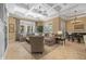 Spacious living room with coffered ceilings, large windows, and comfortable seating area at 1915 Floresta View Dr, Tampa, FL 33618