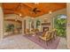 The outdoor seating area features a fireplace, tiled flooring, and screened walls for enjoying the weather at 1915 Floresta View Dr, Tampa, FL 33618