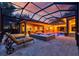 Outdoor swimming pool and spa area with screened enclosure and lounge chairs at 1915 Floresta View Dr, Tampa, FL 33618