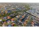 Expansive aerial view showcasing a network of canals and waterfront homes in a beautifully landscaped community at 220 Singapore Rd, Punta Gorda, FL 33950