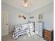 Cozy bedroom with a comfy bed, neutral walls, and a quaint dresser at 220 Singapore Rd, Punta Gorda, FL 33950