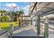 Waterfront property with a private boat dock featuring a tiki bar and boat lift, perfect for enjoying waterfront living at 220 Singapore Rd, Punta Gorda, FL 33950