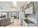 Bright kitchen with modern countertops, white appliances and an eat-in dining area at 220 Singapore Rd, Punta Gorda, FL 33950