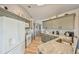 An open kitchen features white appliances, wood floors, and modern countertops at 220 Singapore Rd, Punta Gorda, FL 33950