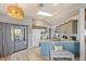 Well-lit kitchen features a breakfast bar, matching appliances, and a sunroom entrance at 220 Singapore Rd, Punta Gorda, FL 33950