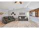 Spacious living room featuring vaulted ceilings, comfortable leather couches, and a 'Margaritaville' bar at 220 Singapore Rd, Punta Gorda, FL 33950