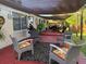 Charming back patio with outdoor seating, a shade sail, and decorative accents, creating a cozy and inviting space at 2400 62Nd N St, St Petersburg, FL 33710
