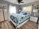Serene bedroom with a queen-sized bed, soft lighting, and calming blue and white accents at 2400 62Nd N St, St Petersburg, FL 33710