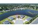 Aerial view of a home situated on a waterfront lot in a quiet neighborhood at 2563 Ocean Breeze Ln, Clearwater, FL 33761