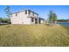 Beautiful backyard featuring a covered porch area and peaceful water view on a clear day at 2563 Ocean Breeze Ln, Clearwater, FL 33761