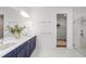 Bright bathroom with a double vanity, walk-in shower, and closet at 2563 Ocean Breeze Ln, Clearwater, FL 33761