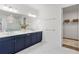 Bright bathroom with a double vanity, walk-in shower, and closet at 2563 Ocean Breeze Ln, Clearwater, FL 33761