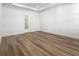 Bright bedroom with hardwood floors and an ensuite bathroom at 2563 Ocean Breeze Ln, Clearwater, FL 33761