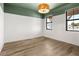 Light and airy bedroom showcasing wood floors and a view at 2563 Ocean Breeze Ln, Clearwater, FL 33761