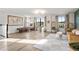 Bright bonus room with game tables, hanging chairs, and stylish decor create an inviting space at 2563 Ocean Breeze Ln, Clearwater, FL 33761
