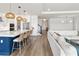 Open floor plan showcasing a modern kitchen with a large island, opening up to the living room at 2563 Ocean Breeze Ln, Clearwater, FL 33761