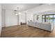 Bright living room with modern lighting, fireplace, and large windows overlooking the water at 2563 Ocean Breeze Ln, Clearwater, FL 33761