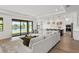 Spacious living room with lake views and a seamless connection to the kitchen at 2563 Ocean Breeze Ln, Clearwater, FL 33761