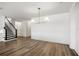 Bright living room with hardwood floors and modern staircase at 2563 Ocean Breeze Ln, Clearwater, FL 33761